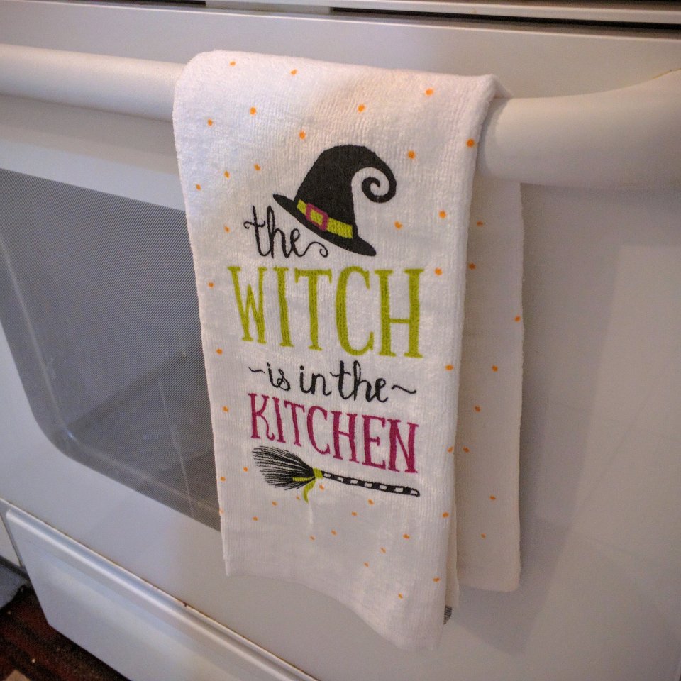 Towel with the words "The Witch is in the kitchen"