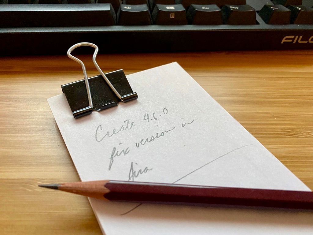 Index card with "Create 4.6.0 fix version in Jira" written on it